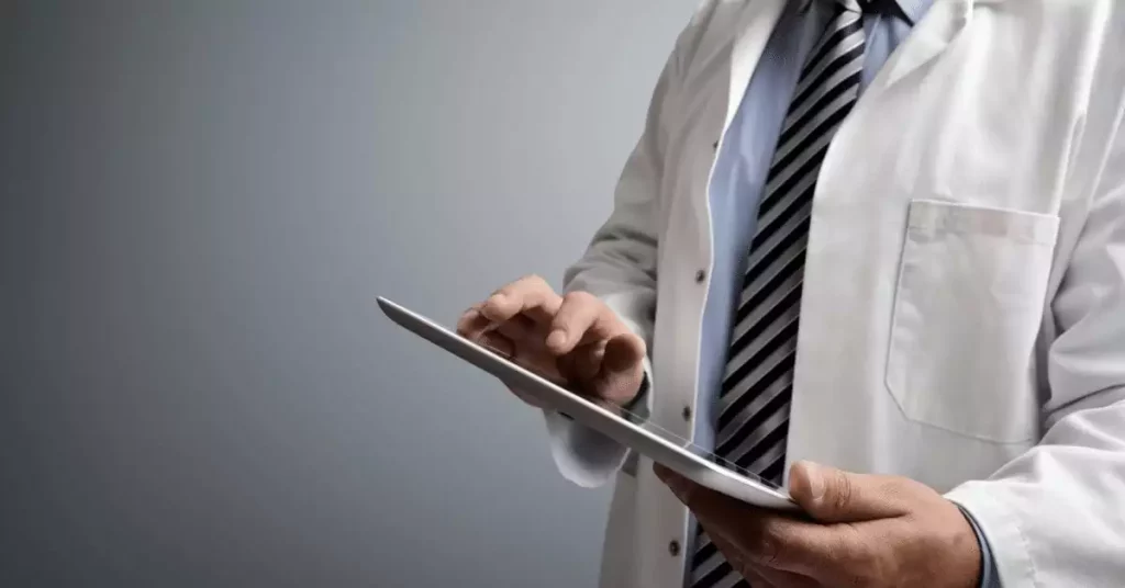Doctor with tablet