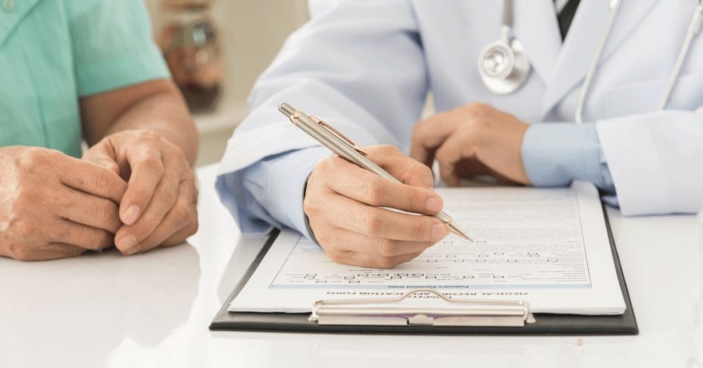 Doctor with clipboard and pen