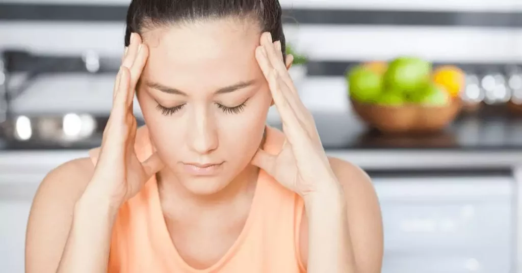 Woman rubbing her temples