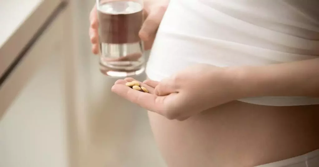 Pregnant woman taking medication