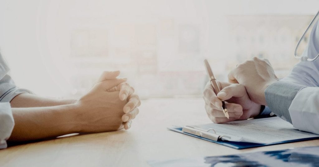 Doctor talking to patient