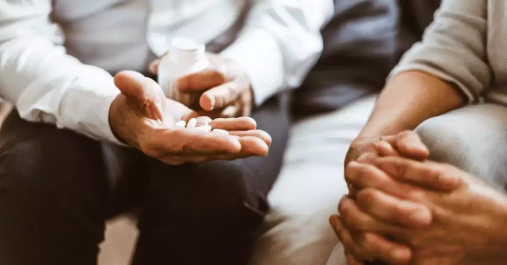 doctor showing migraine medications to a patient