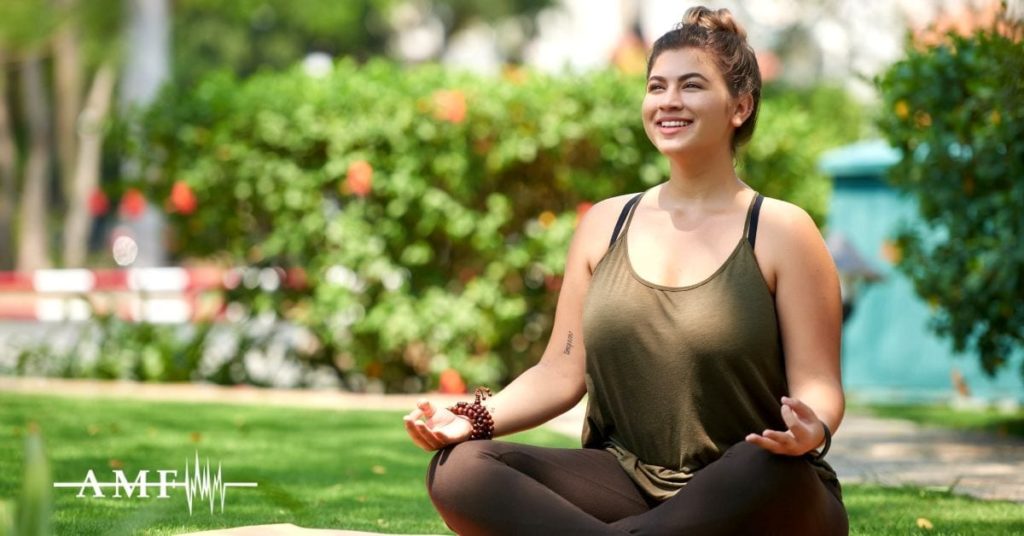Woman meditating outside