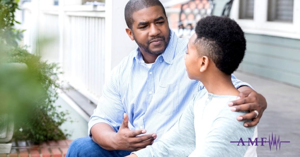 Father and child having migraine discussion