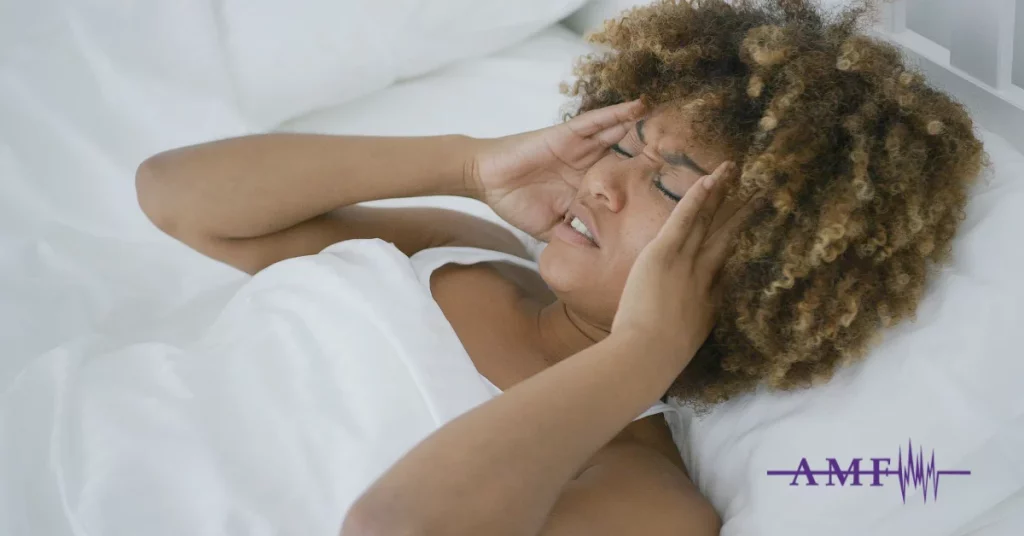 Someone Suffering From Status Migrainosus In Bed